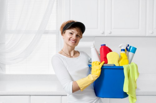 Local cleaner treating stains on a lounge sofa