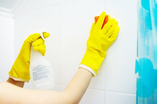 Local technician assessing upholstery stain removal in NW3